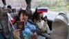 В сюжетах медиа группировок «ЛДНР» все ехавшие на голосование в Россию были счастливы, снабжены флажками и готовы говорить на камеру, что это для них честь