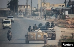 “Haýýat Tahrir aş-Şam” jeňçileri Aleppo welaýatynda, 2024-nji ýylyň 29-njy noýabry.